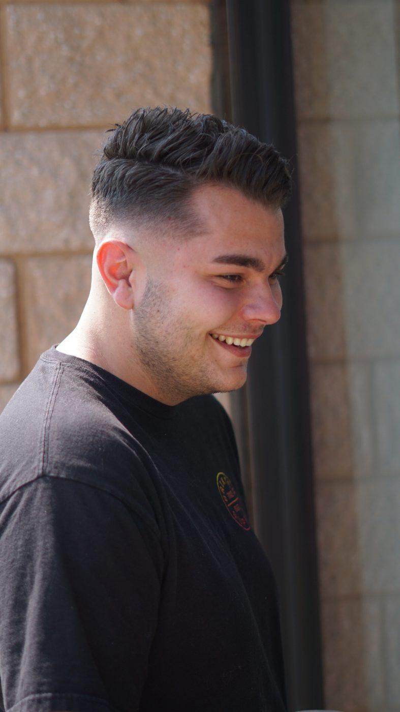 Textured pompadour with a taper fade